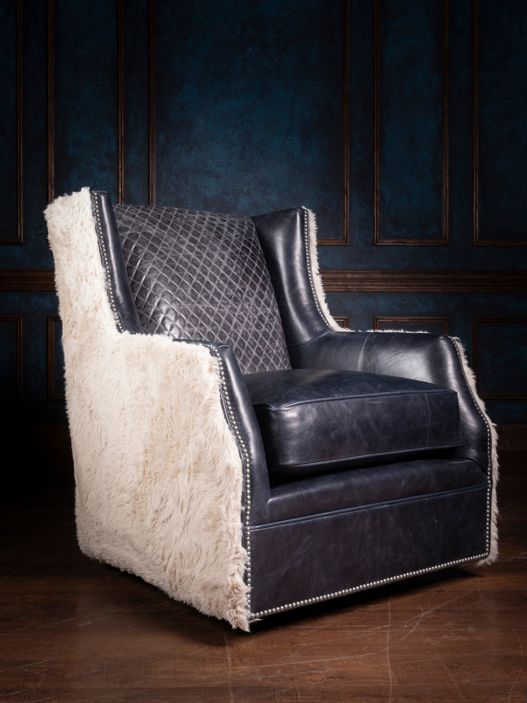 Luxury Cowboys Blue Leather Swivel Chair with Quilted Back and Shearling Sides - Western-inspired Accent Chair with Nailhead Trim, Ideal for Ranch-style Living Rooms.