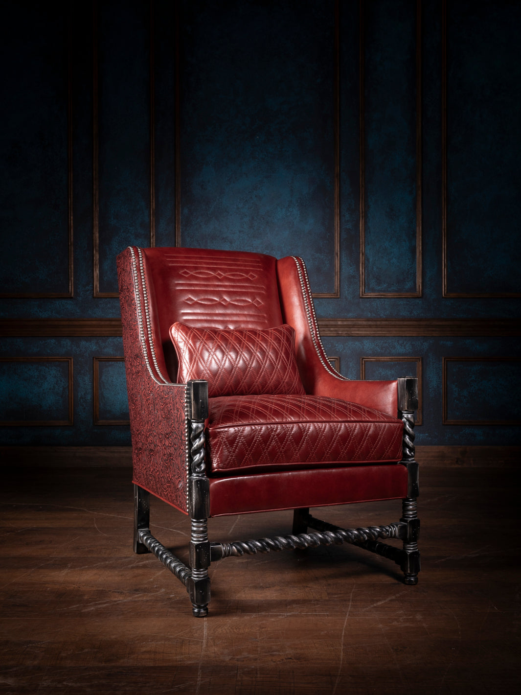 Crimson quilt diamond leather accent chair with twisted wooden legs and nailhead trim, featuring a luxurious diamond-stitched leather seat and backrest.