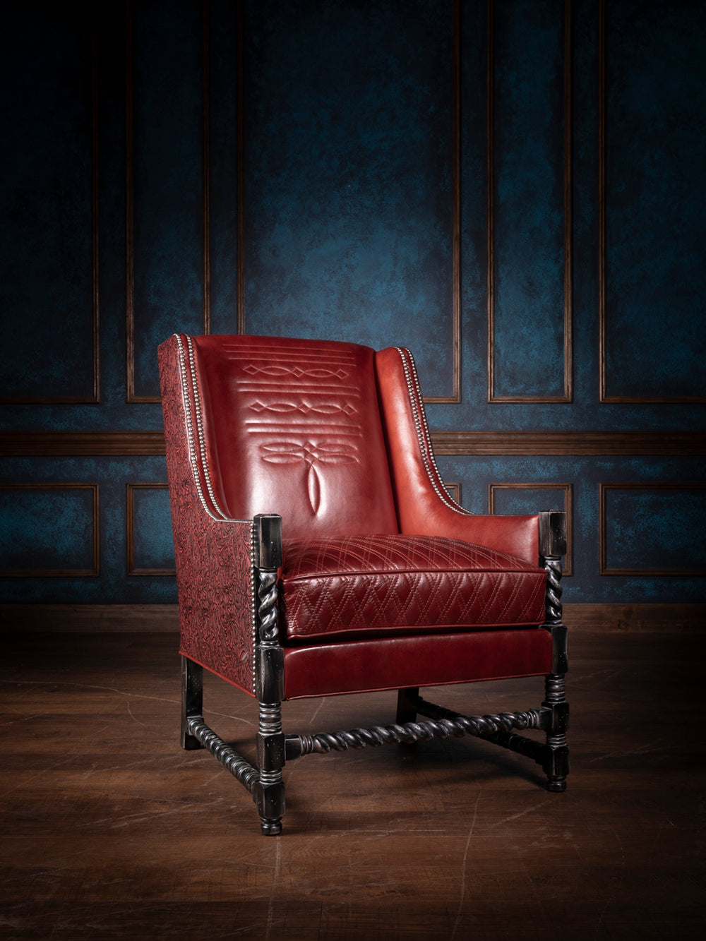 Crimson quilt diamond leather accent chair featuring a diamond-stitched leather backrest and seat, twisted wooden legs, nailhead trim, and rich embossed leather side panels.