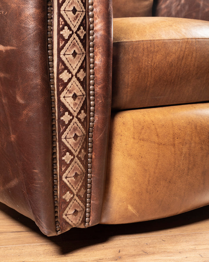 Detailed lower front view highlighting the crisp contrast stitching and hand-finished deep chocolate pull-up leather panels on the base.