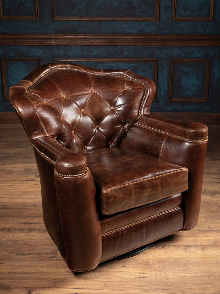 Side angle of the Dark Rum leather swivel chair showing sculpted armrests and hidden 360-degree swivel base.