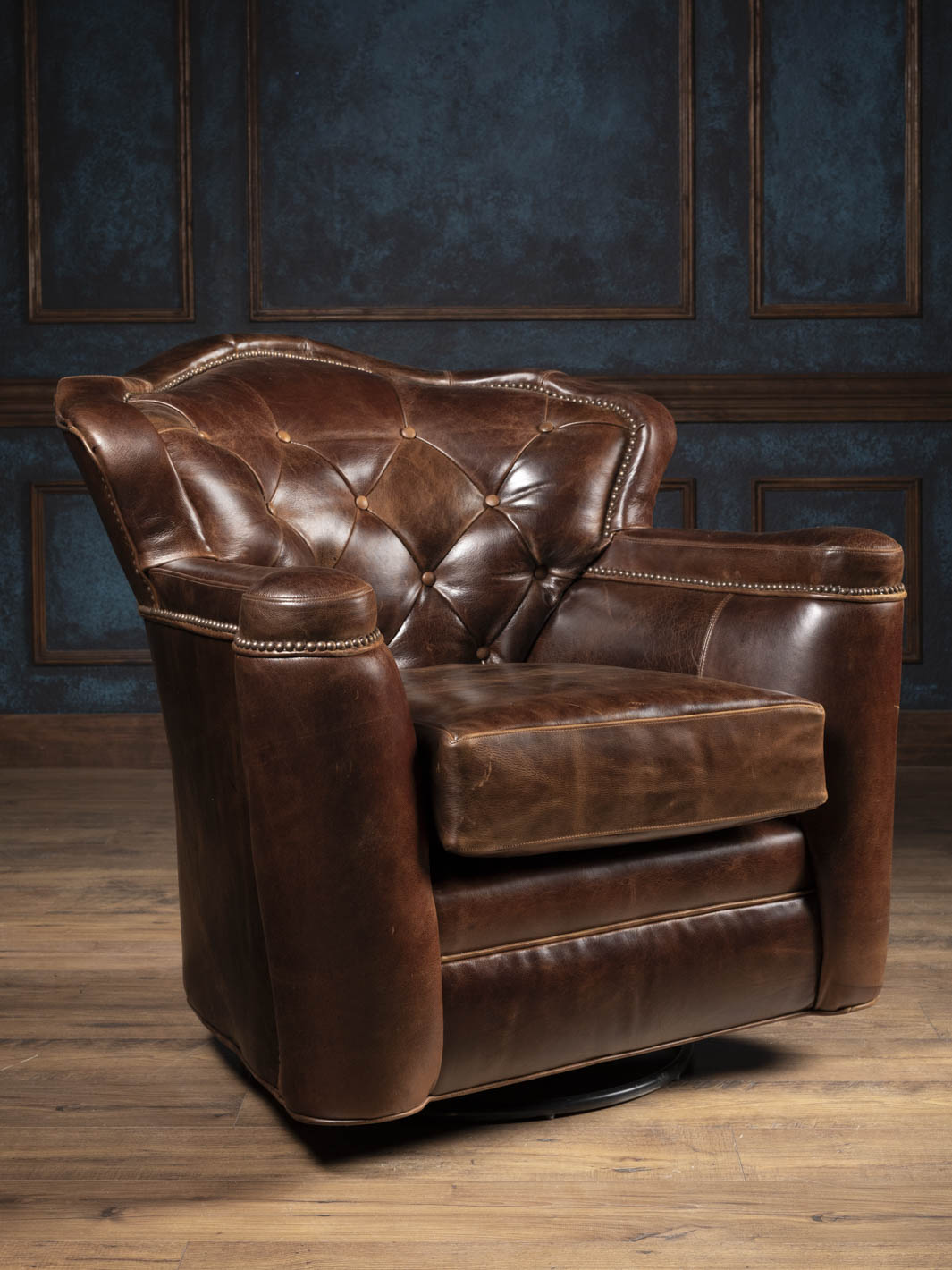Dark Rum tufted leather swivel chair with full-grain buffalo leather and deep diamond tufting, front view