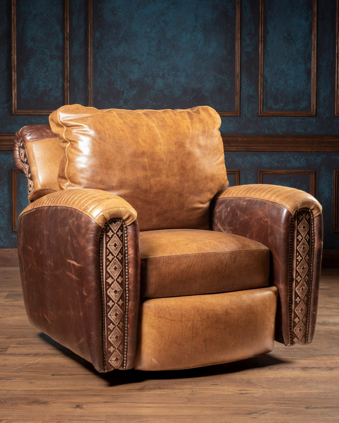 Front view of the Dutton Western two-tone leather swivel recliner chair handcrafted in Texas with saddle tan and deep chocolate pull-up leather.