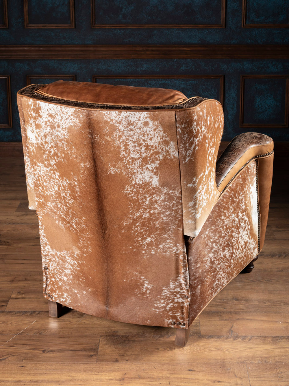 Golden Range Utah Bronco with cowhide on outside back and embossed crocodile trim accent in a ranch inspired living space.