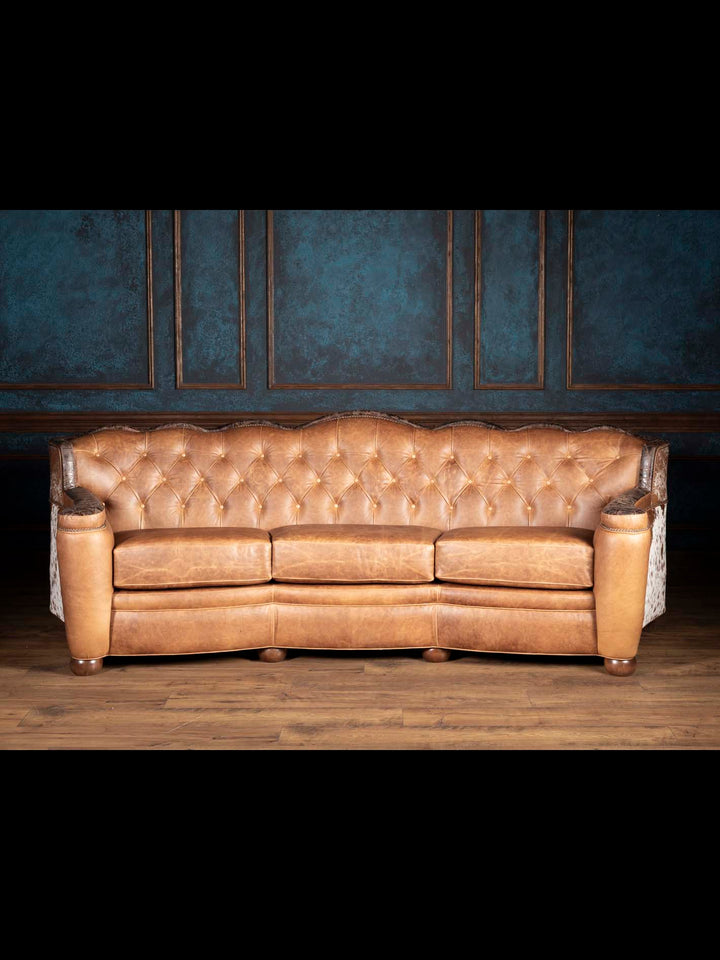 Golden Range Leather Sofa in full-grain leather with a deep tufted back in a western inspired living space.
