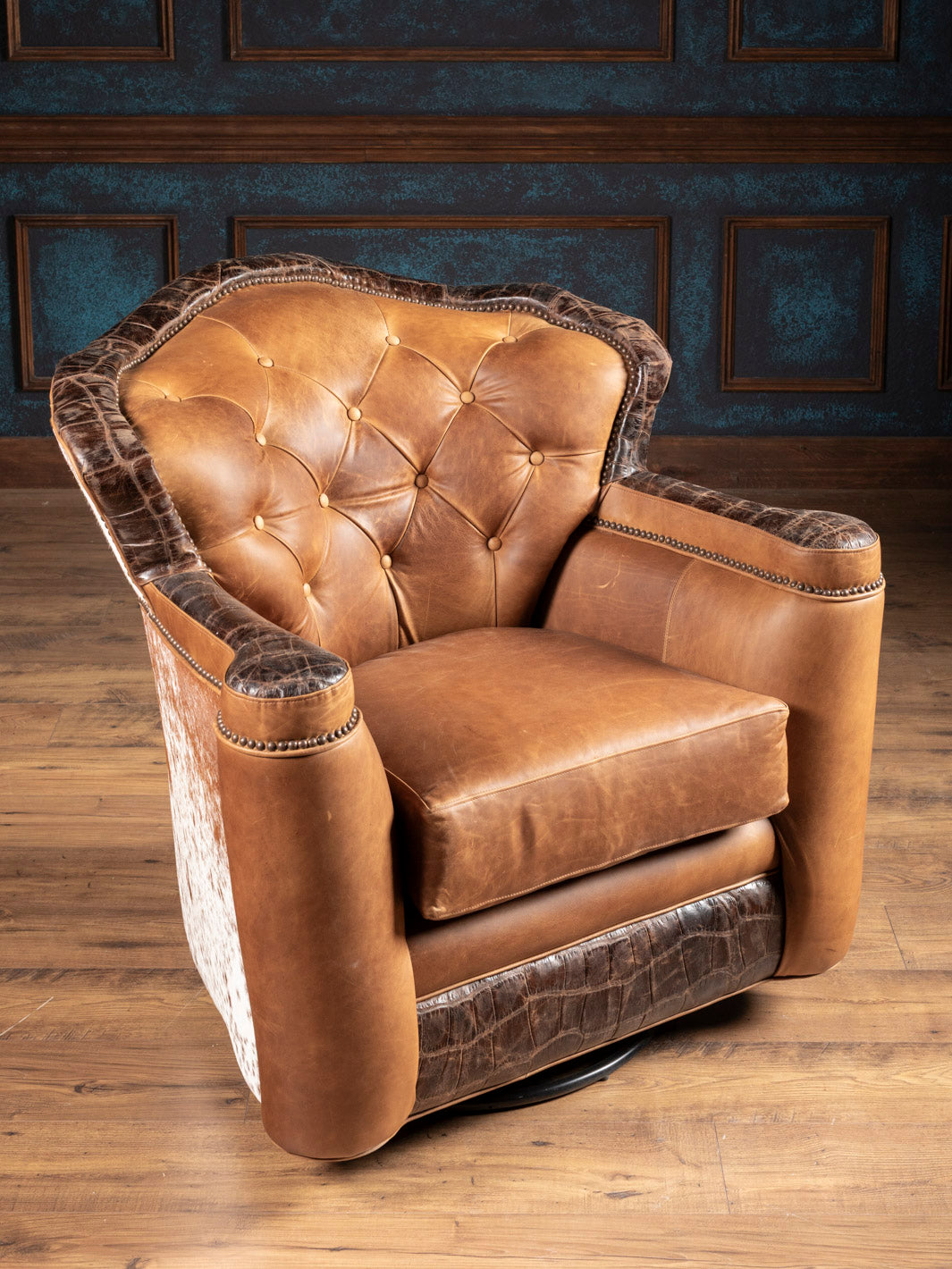 Golden Range Swivel Chair in a chestnut brown leather with crocodile embossed leather trim accent in a western living room.