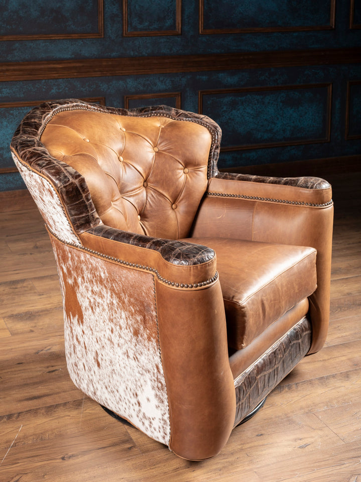 Golden Range Swivel Chair in a brown leather featuring embossed crocodile leather and hair on hide accents in living space.