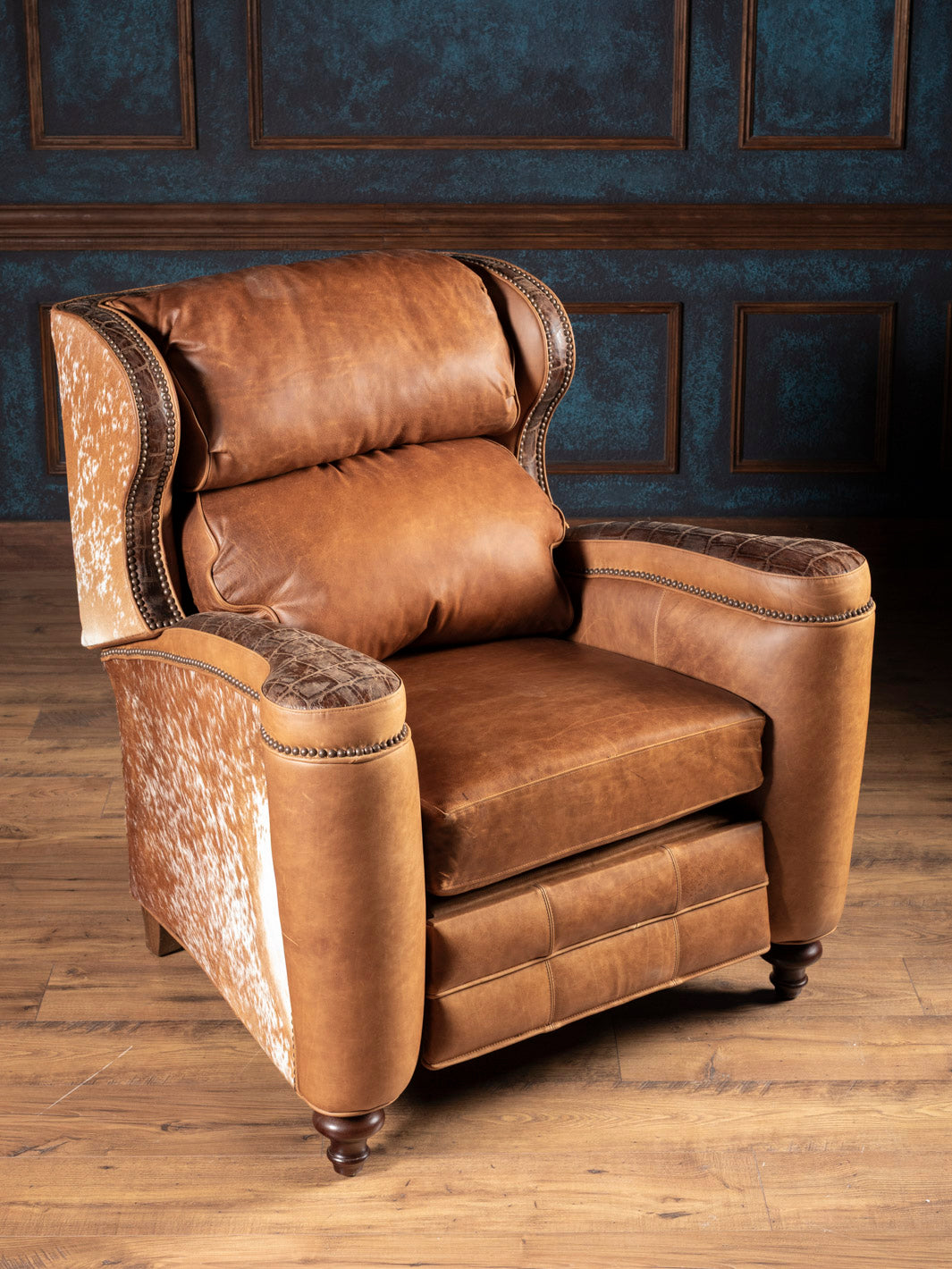 Golden Range Leather Recliner in chestnut full-grain leather with cowhide and embossed leather accents in a western living space.