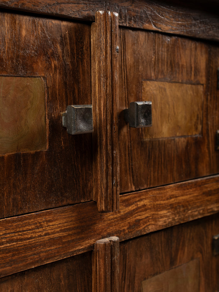 Detailed close up view of the hand forged iron cabinet knobs and unique rustic door pull design on the rustic wood chest.