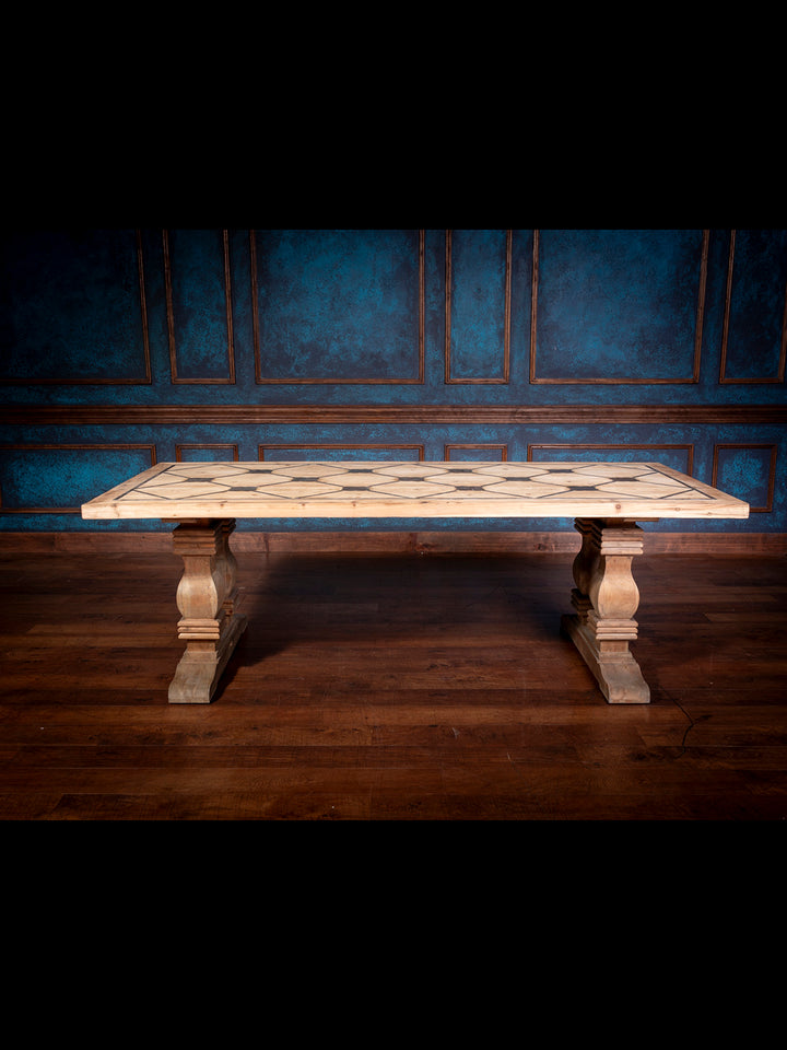 Front view of handcrafted Western-style pine dining table featuring blue stone inlay and carved pedestal legs on a rich hardwood floor