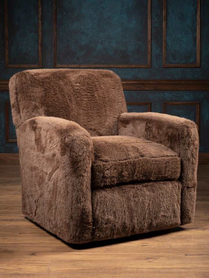 Kodiak Grizzly-Brown Swivel Chair in plush brown faux fur, showing broad arms and a cushioned seat from a front angle.