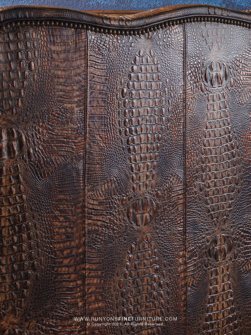 Lakota Utah Red Leather Sofa outside back in brown crocodile stamped leather in a close-up view.