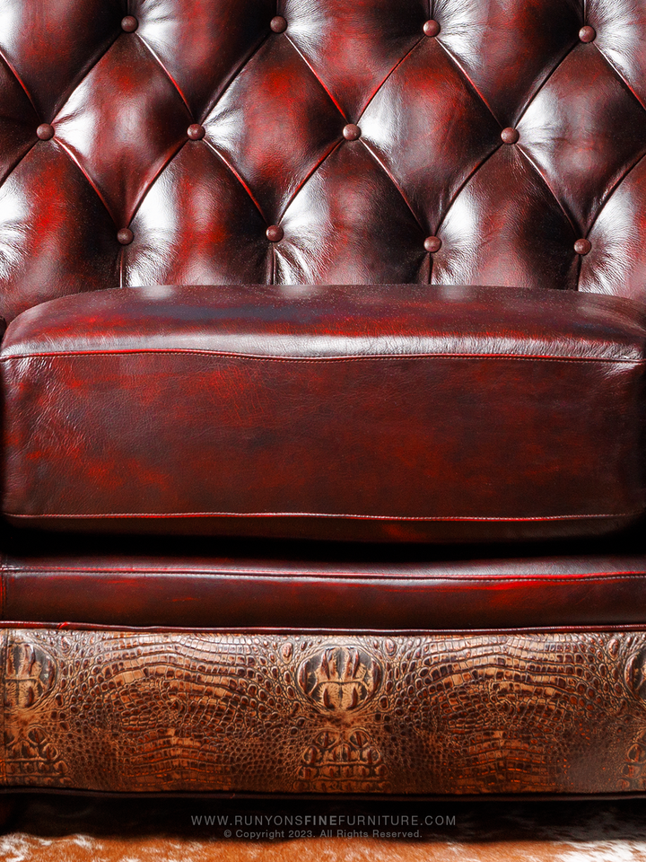 Lakota Utah Red Leather Sofa in burnished Puglia red leather with tufted inside back  and crocodile brown trim in a up-close view.