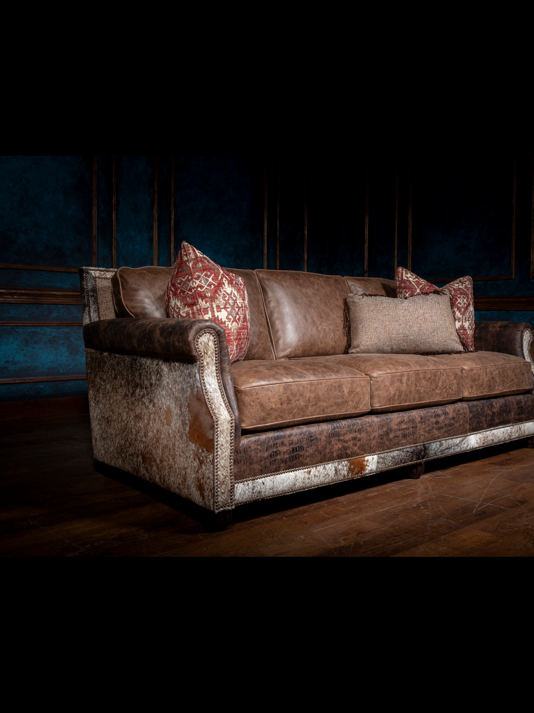 Luxurious Leather and Fabric Sofa with hair-on-hide panels, crocodile-embossed trim, and rolled arms shown in a full view.
