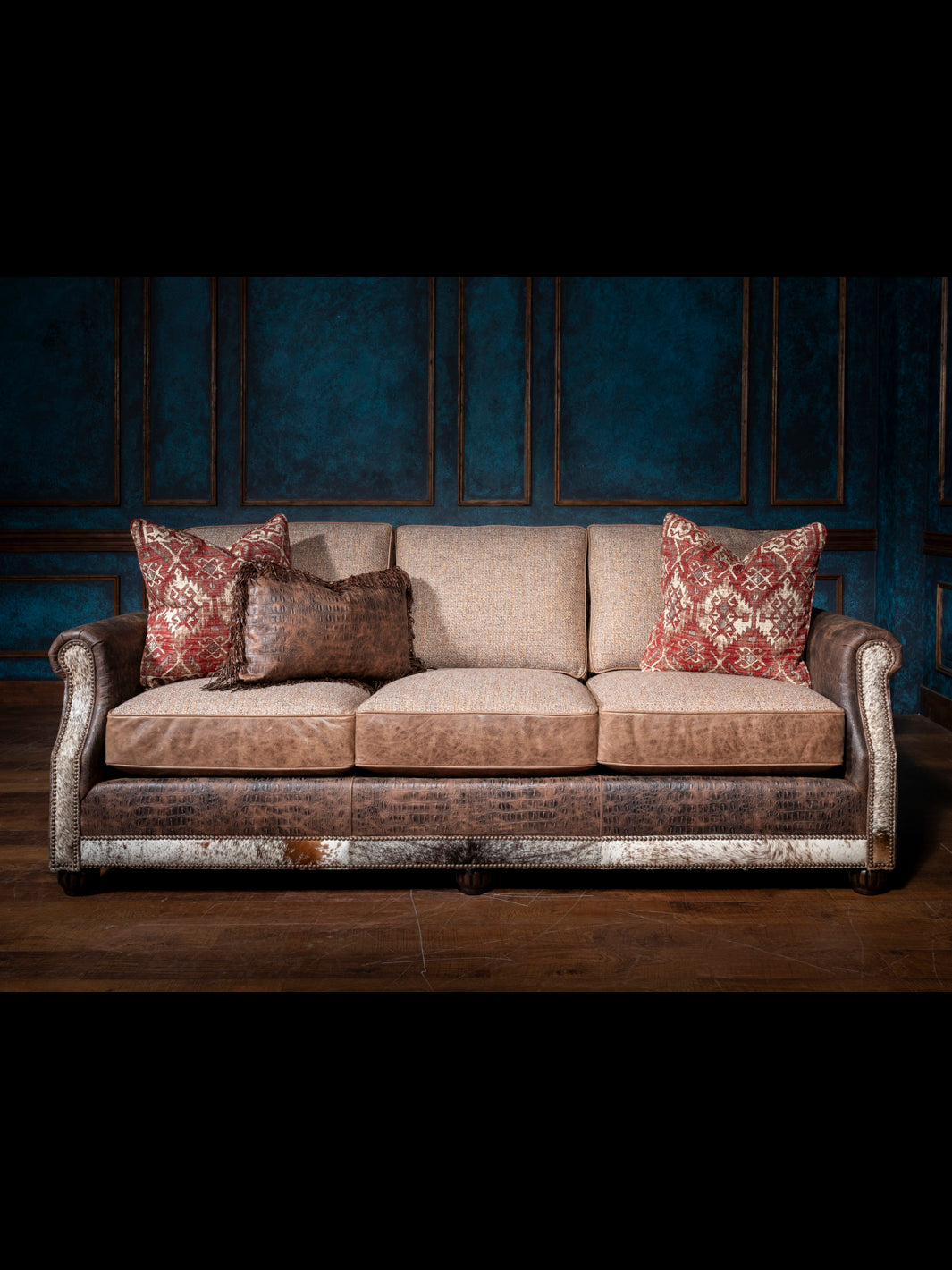 Luxurious Leather and Fabric Sofa with  reversible leather and fabric cushions in a rustic inspired living space. 