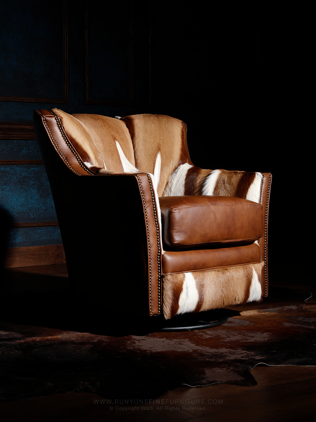 italian brown leather swivel chair with authentic springbok hair on hide.