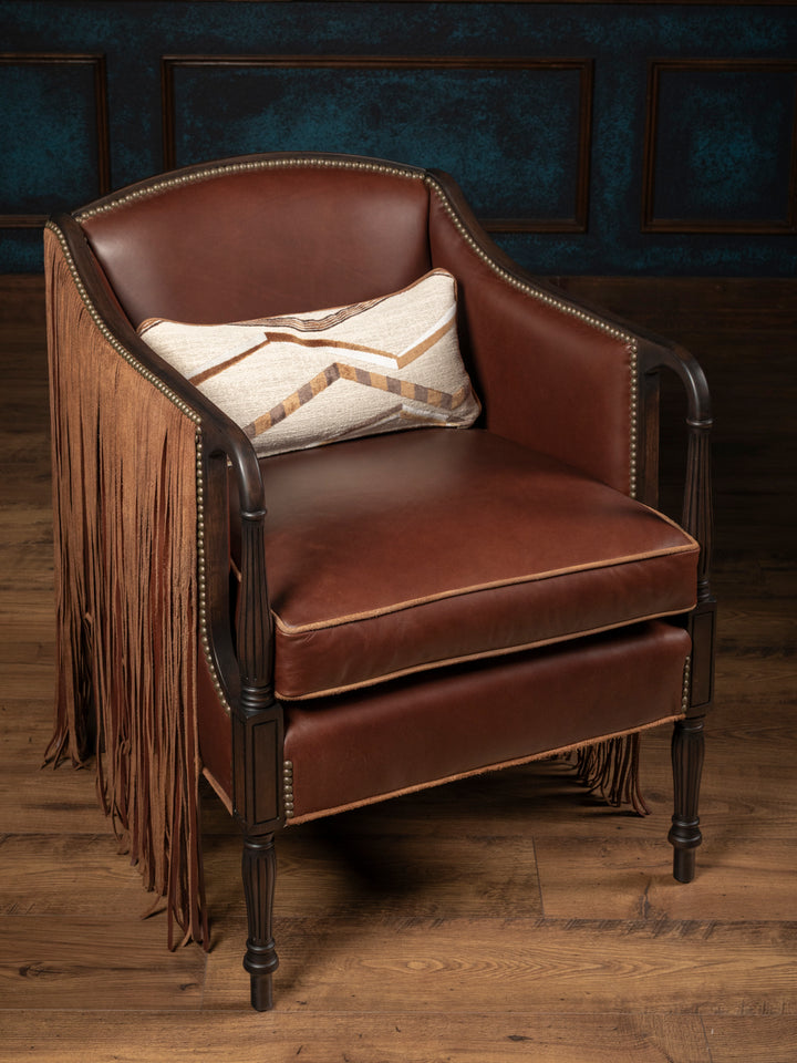 High-angle front view of the custom Boulder cowhide accent chair displaying a full smooth warm cognac full-grain leather seat cushion configuration.
