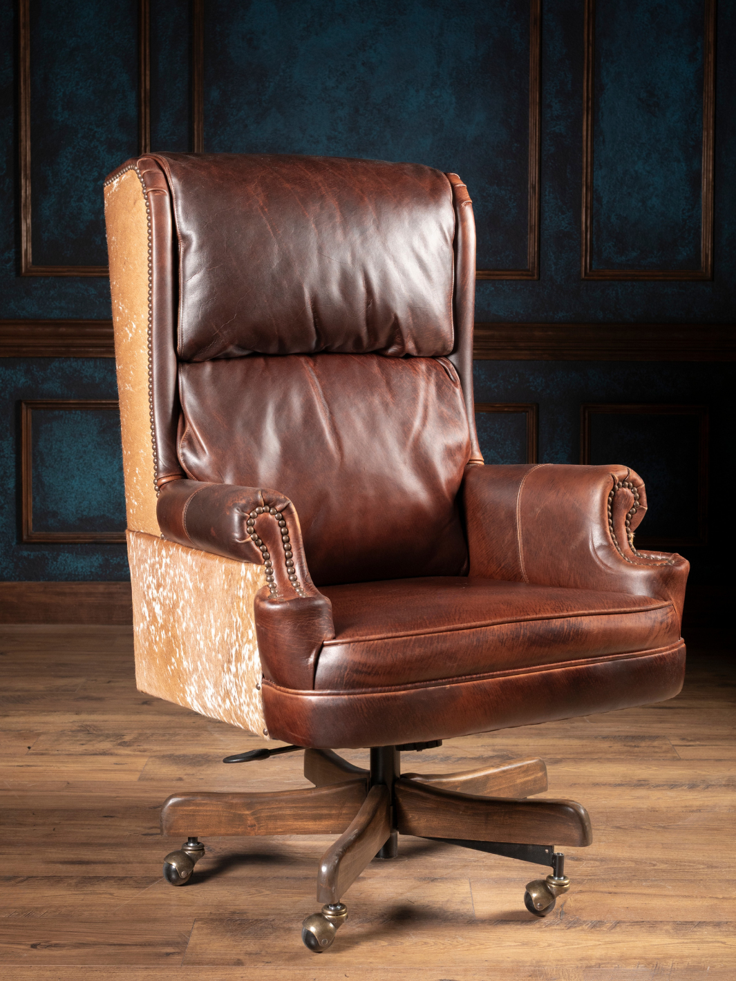 Midland Executive Leather Desk Chair in dark walnut leather with speckled cowhide accents in a office space.
