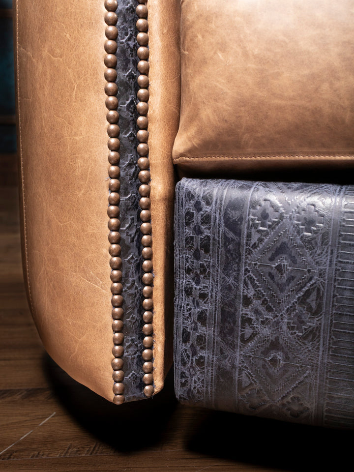 Navy tooled leather accent on the Amber Range recliner, featuring an embossed Western-inspired diamond motif