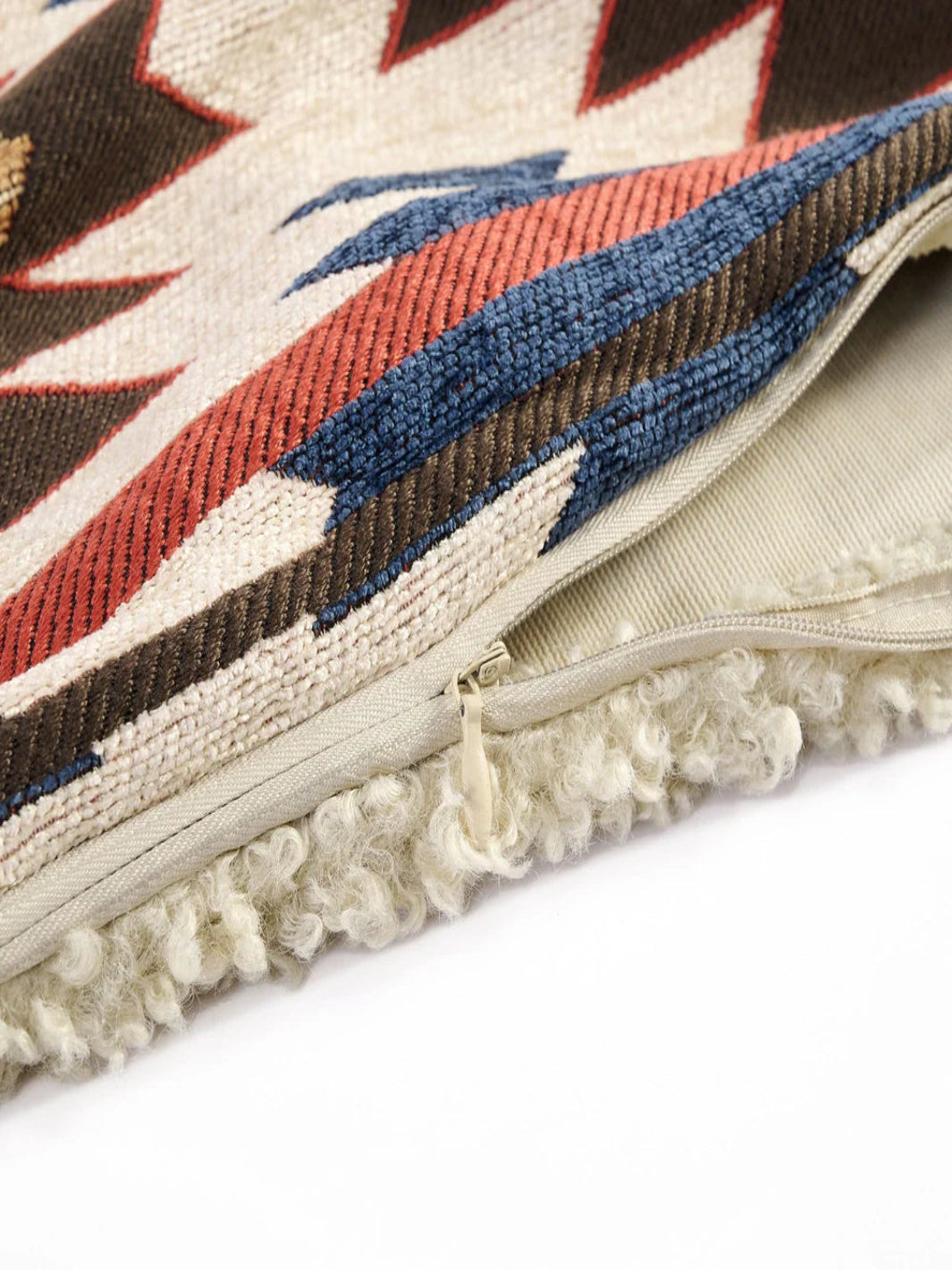 Close-up of a textured pillow with geometric pattern on a white background