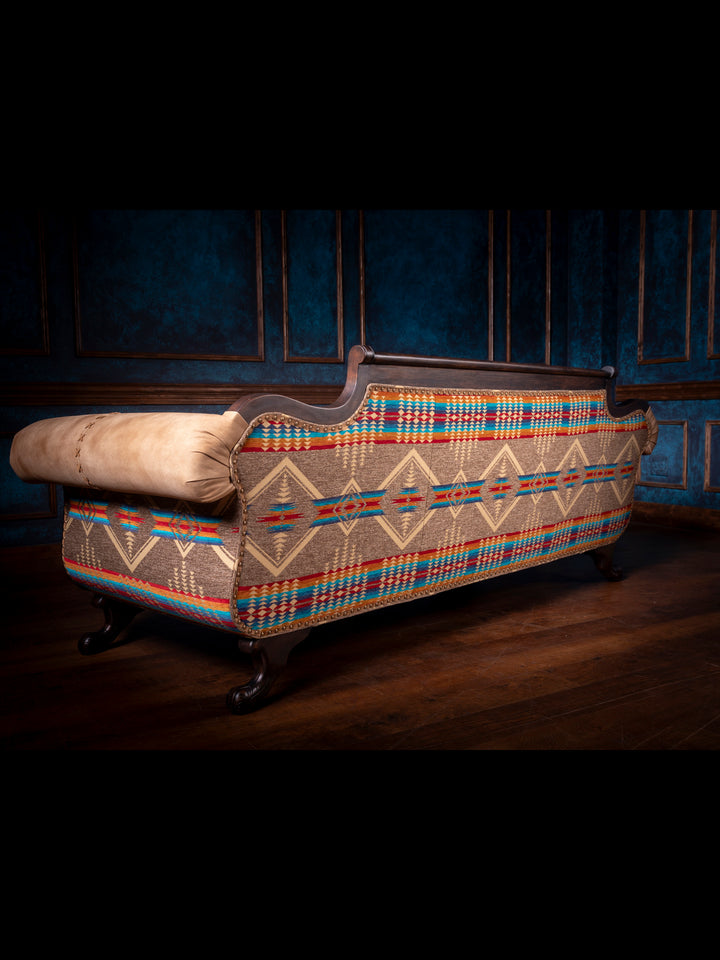 Duncan Phyfe Steer Leather Sofa with Southwestern Fabric on outside back and arms in a western living space.