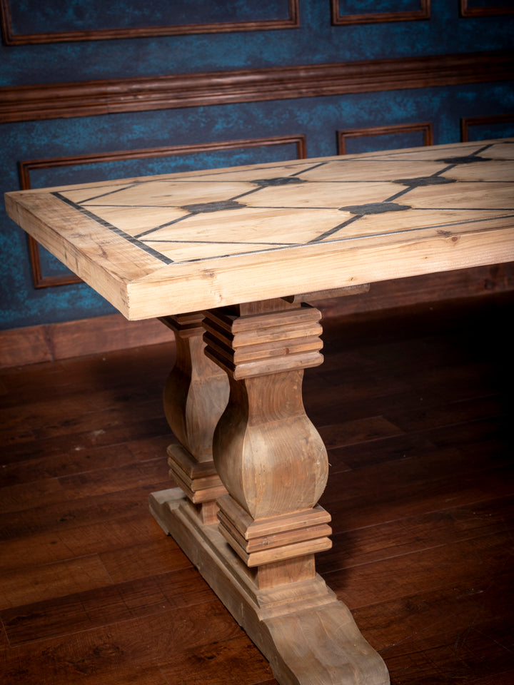 Artisan-crafted pine dining table corner showcasing thick top edge and Western-inspired inlay