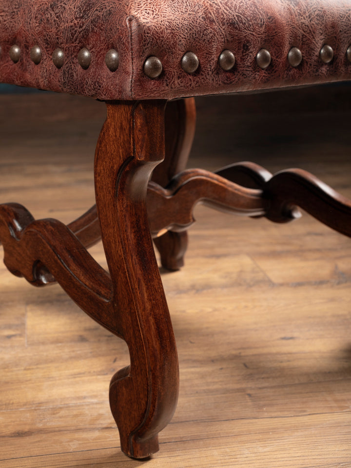 Carved solid hardwood legs and stretcher construction on the Prescott leather dining chair