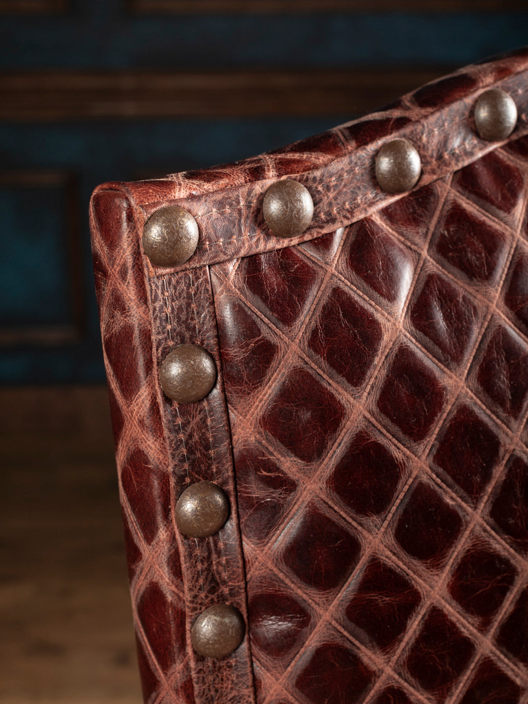 Diamond-stitched leather and decorative nailhead trim on the Prescott Western dining chair