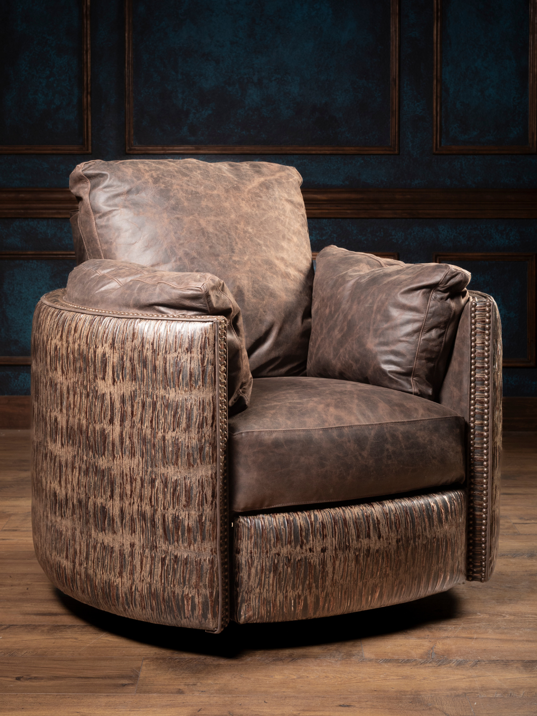 Rimrock Leather Snug Swivel Recliner in full-grain leather with embossed leather accents, styled in a Western living space.