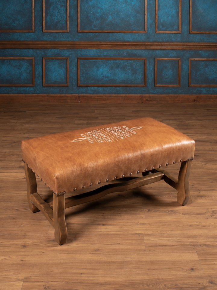 Saddle Reserve Santa Fe Western bench in saddle brown full-grain aniline leather with boot stitch embroidery in a rustic inspired entryway.