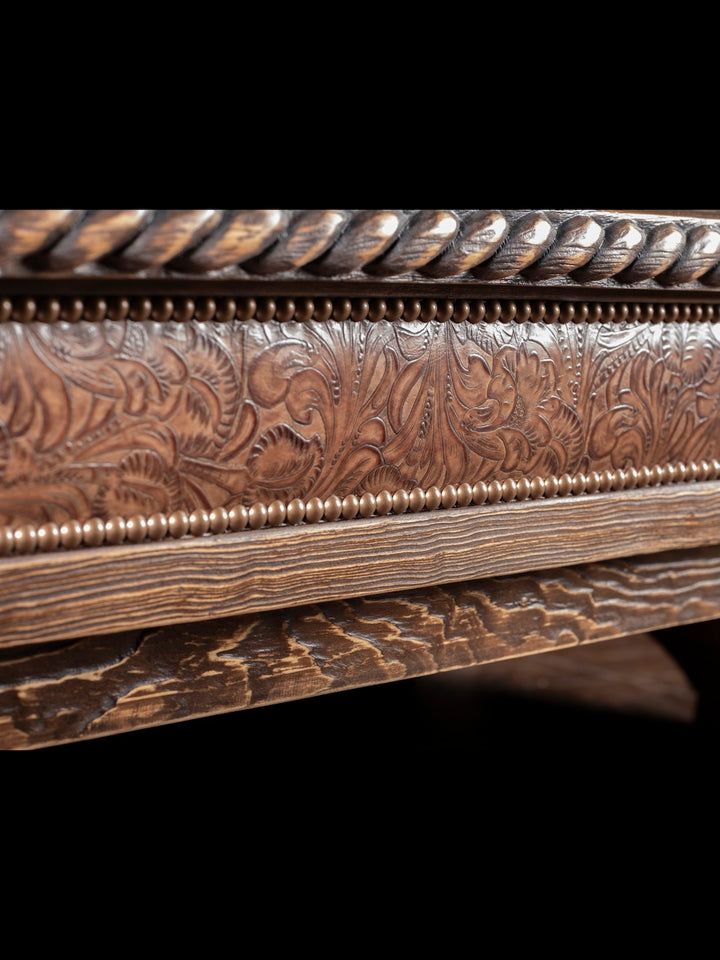 Saddle Ridge Shadow Box Coffee Table in solid wood with embossed brown floral leather and brass nailheads in a close-up view.