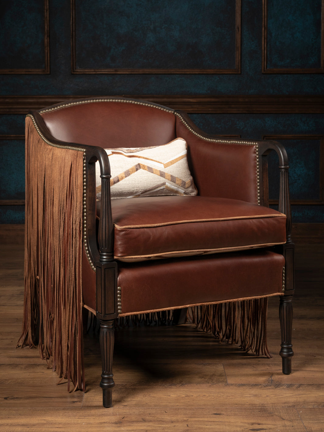 The Boulder rustic leather armchair with its reversible seat cushion flipped to the smooth warm cognac full-grain leather side with matching lumbar accent pillow.
