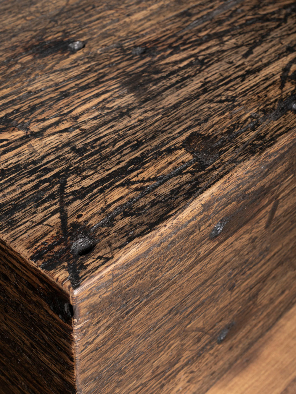 Reclaimed Oak Beam Coffee Table with brown distressed wood details.
