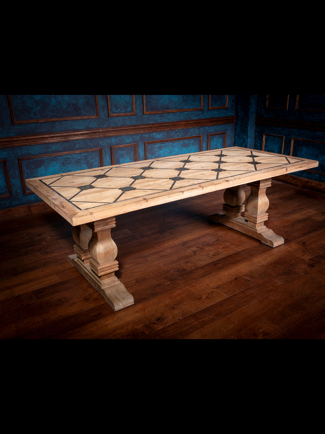 Full view of handcrafted rustic pine dining table with blue inlay design and pedestal base, styled in Western interior setting