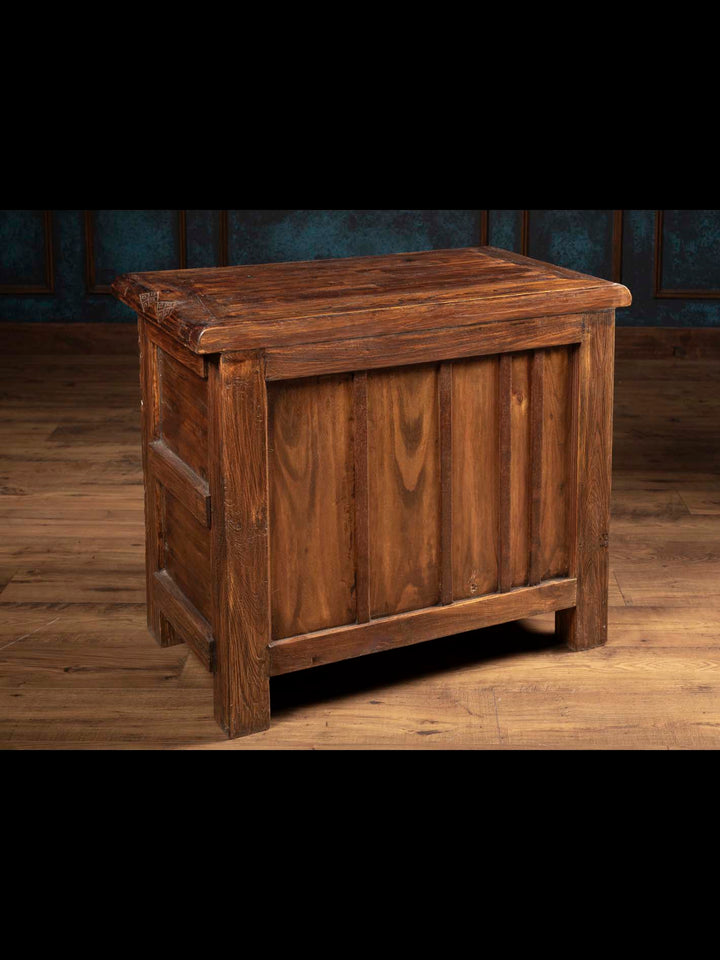 The finished solid reclaimed wood back paneling view of the Jason Scott 4 door rustic bedside chest showcasing full artisan construction.