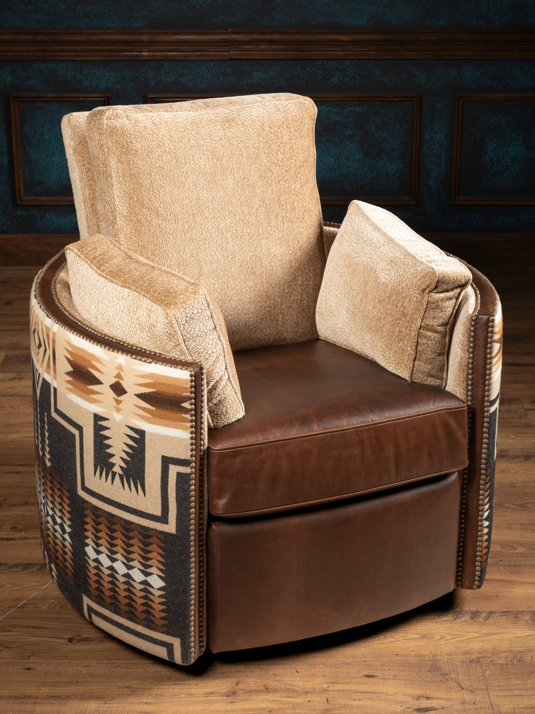 High-angle front view of the Adobe Trail southwestern accent chair showcasing the plush oatmeal-colored textured chenille backrest and deep matching arm pillows nested inside the upholstered leather frame.