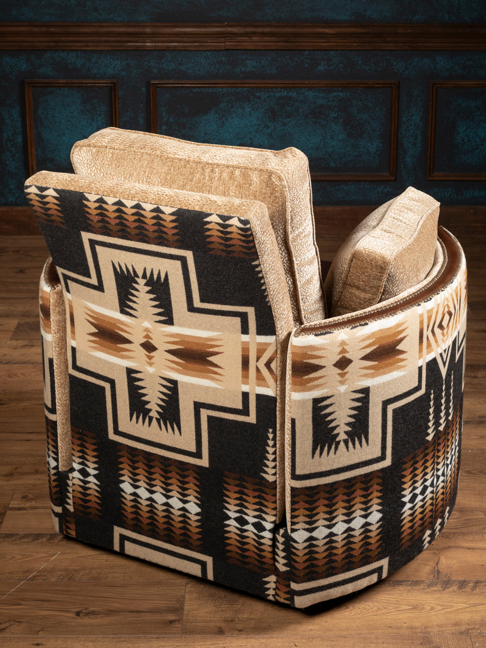 Detailed high-angle shot highlighting the clean material contrast where the rich brown patina leather meets the woven southwestern geometric print blanket fabric on the inner barrel arm.