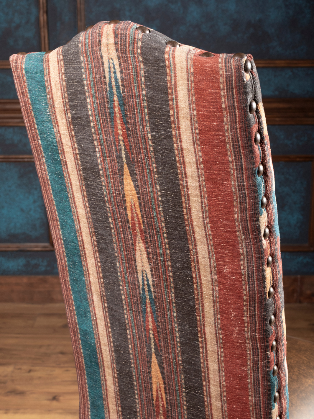 Southwestern Stripe Leather Dining Chair with a Southwestern Stripe fabric in a close up view.