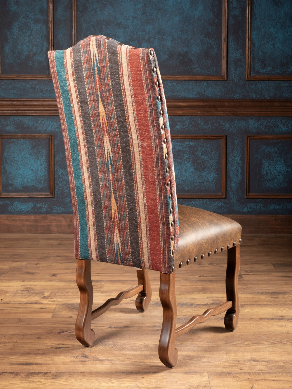 Southwestern Stripe Leather Dining Chair crafted from kiln-dried hardwood in a rustic inspired dining space.