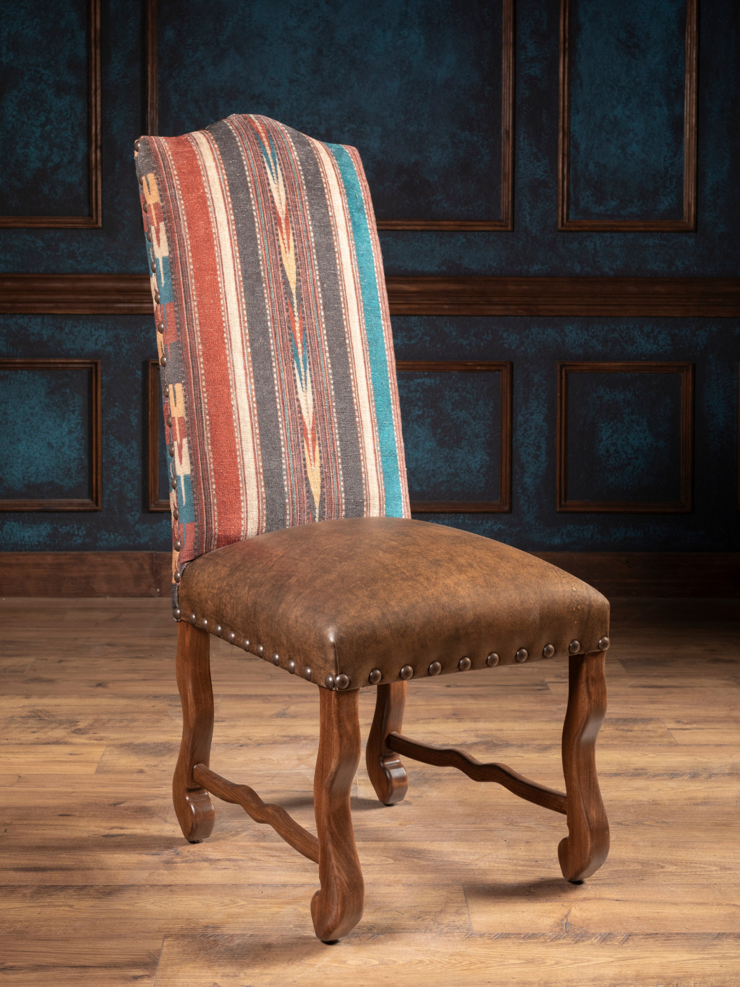 Southwestern Stripe Leather Dining Chair with southwestern strip fabric and leather seat in a western dining space.