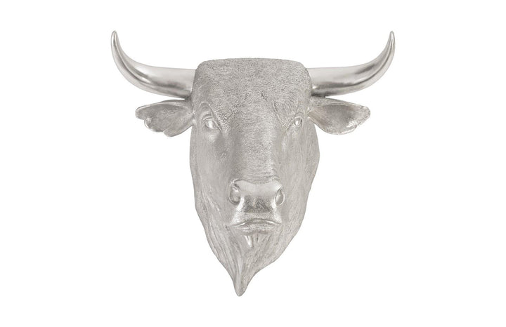 Silver bull head wall decoration on a white background