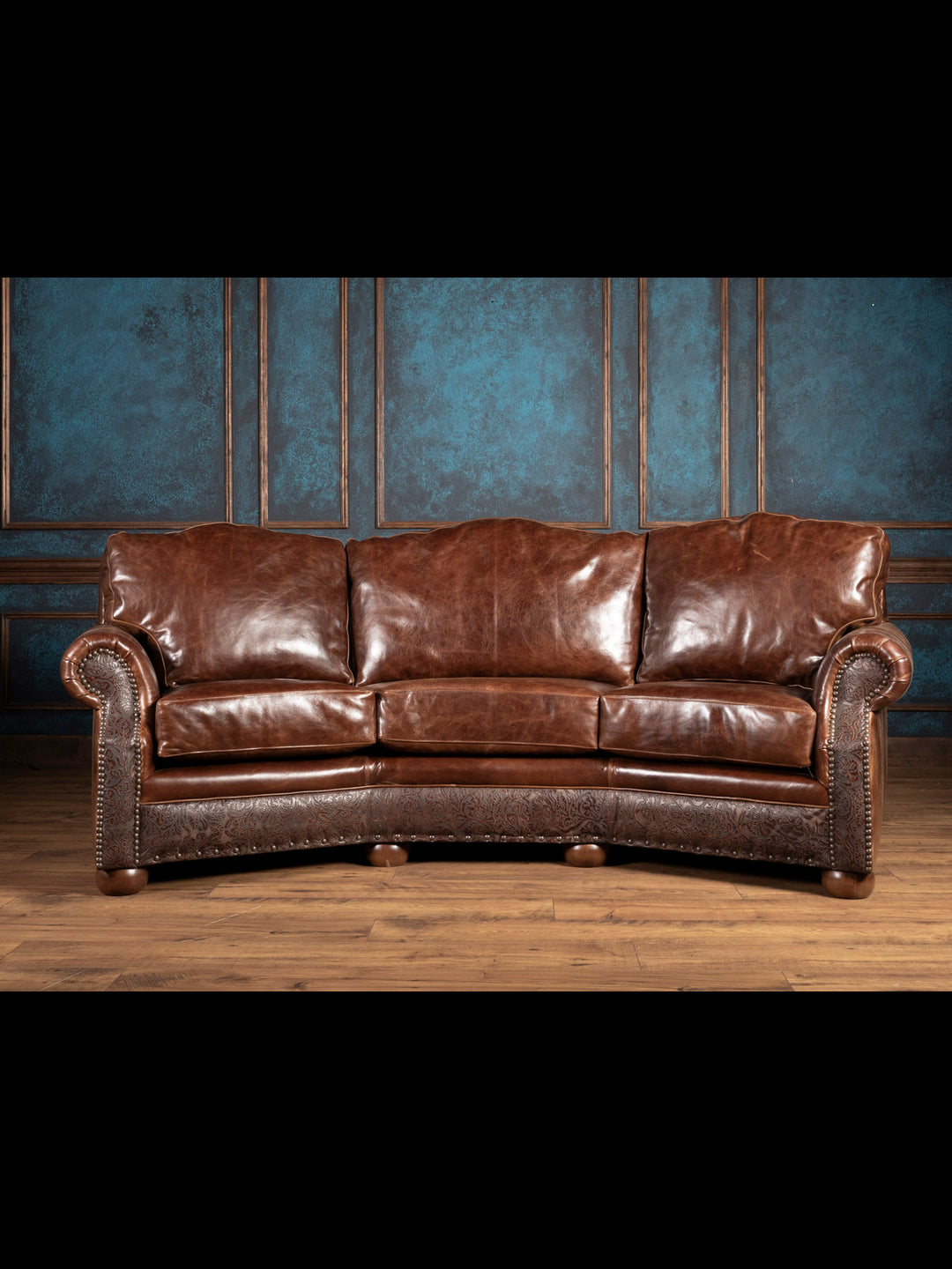 Texas Luxe Leather Curved Sofa in full grain leather with embossed floral leather inlays in a western inspired space.