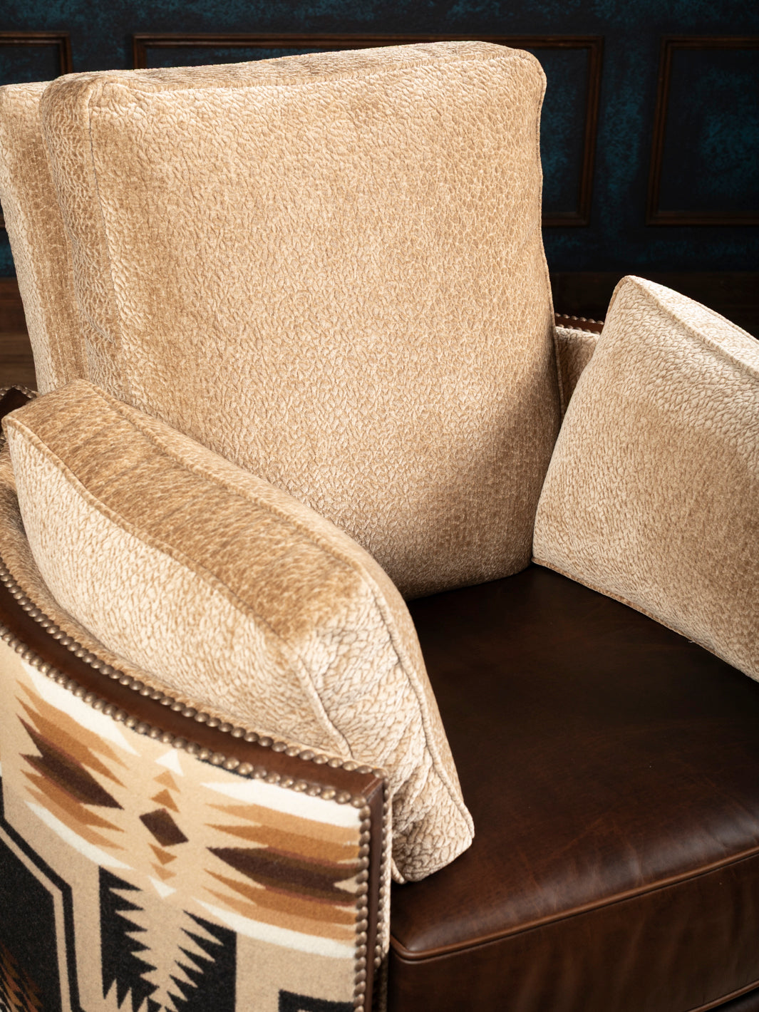 Macro close-up detail of the heavy, thick oatmeal textured chenille weave used on the removable backrest and armrest cushions of a western armchair.