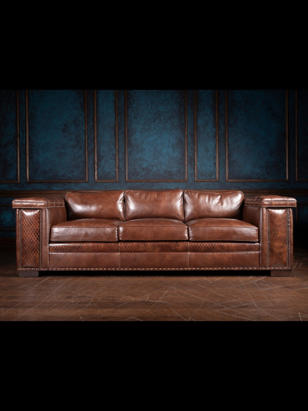 Tufted Cigar Lounge Sofa in Tuscany brown leather and diamond stitch leather inlays in a western living room.