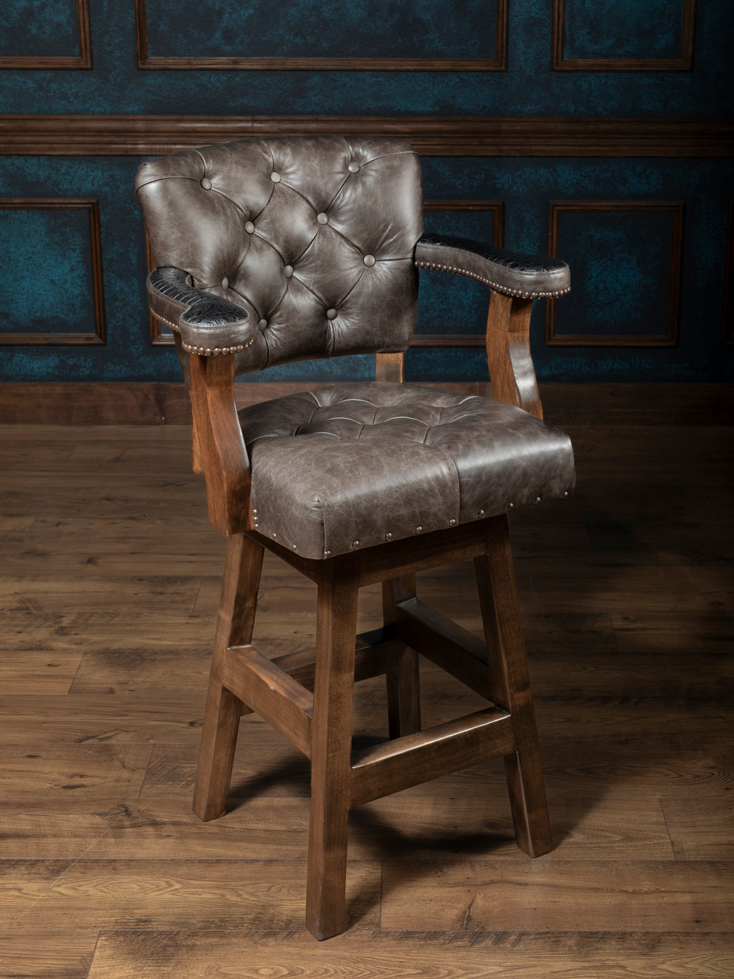 Tufted Greystone Leather Bar Stool in grey full grain leather with embossed black crocodile accents in a western bar space.