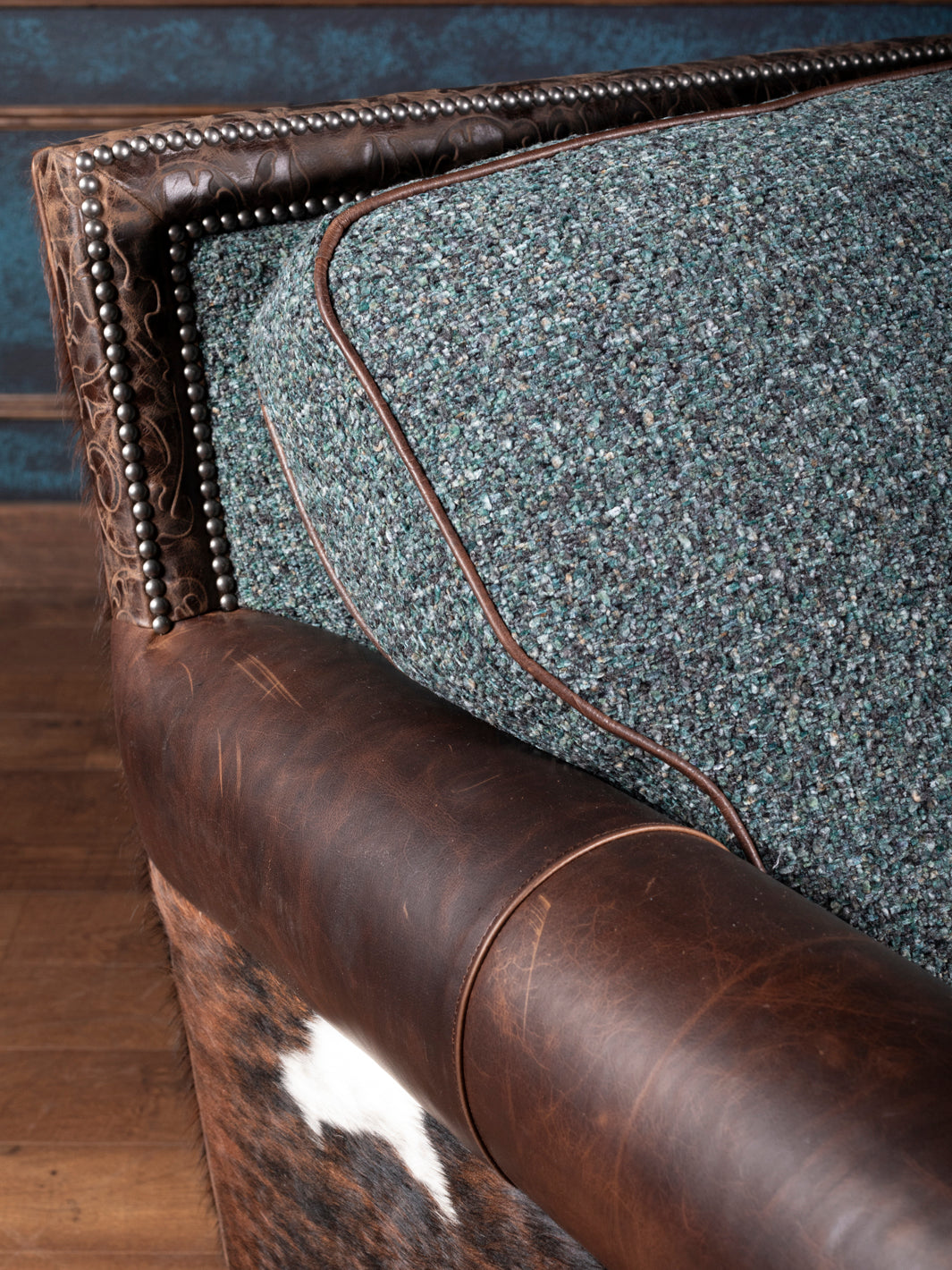 Turquoise Leather & Fabric Chaise Lounge with turquoise fabric cushions and leather accents shown in a close-up view.