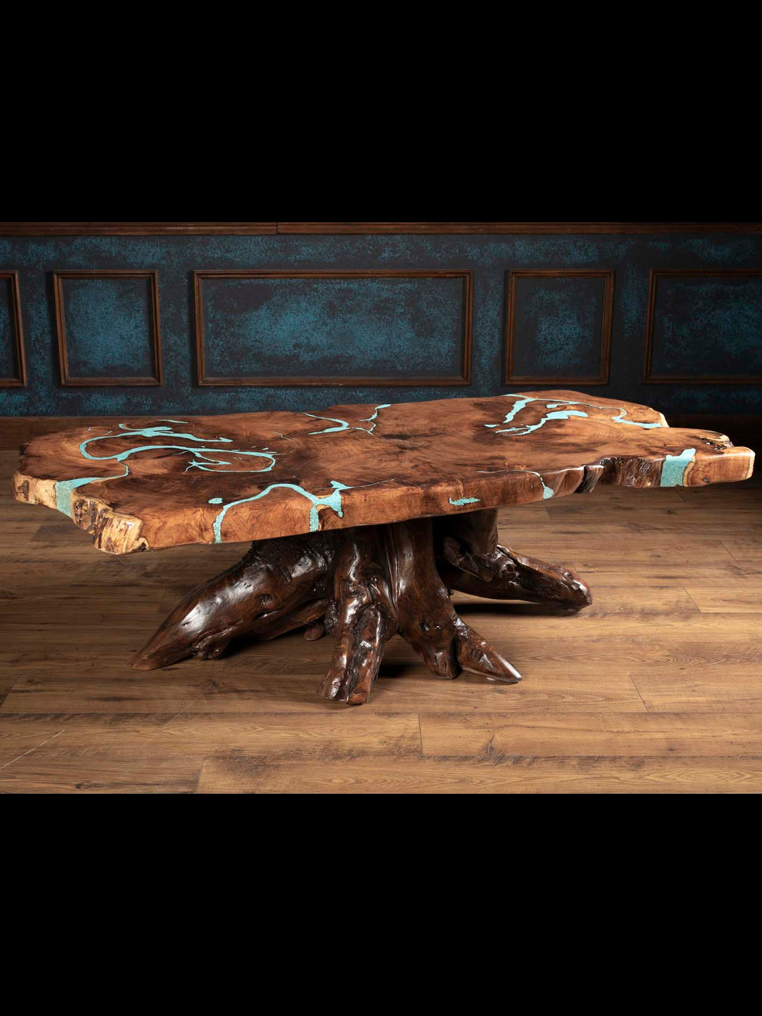 Angled view of the Turquoise Inlay Mesquite Coffee Table showing its irregular live-edge top and sculptural wood base.
