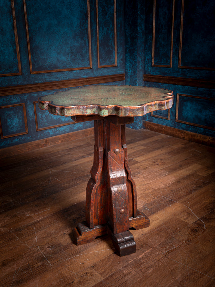 Front view of handcrafted Verde Copper Live Edge Pub Table with rustic wooden base and hand-hammered top.