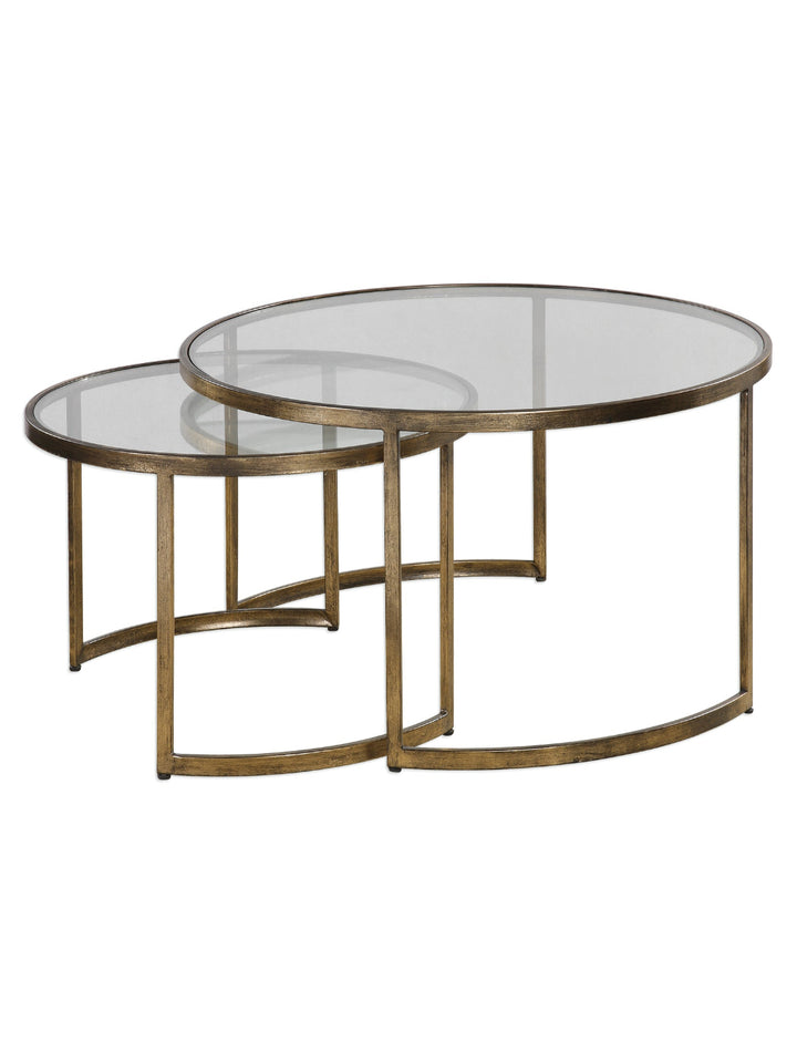 Set of two gold-framed glass tables on a white background