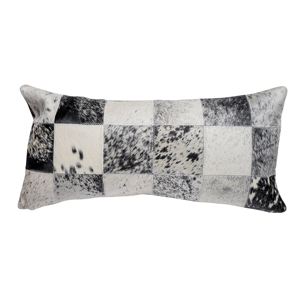 Lumbar pillow featuring a patchwork design in black, white, and gray hair on hide with a salt-and-pepper speckled pattern across the squares
